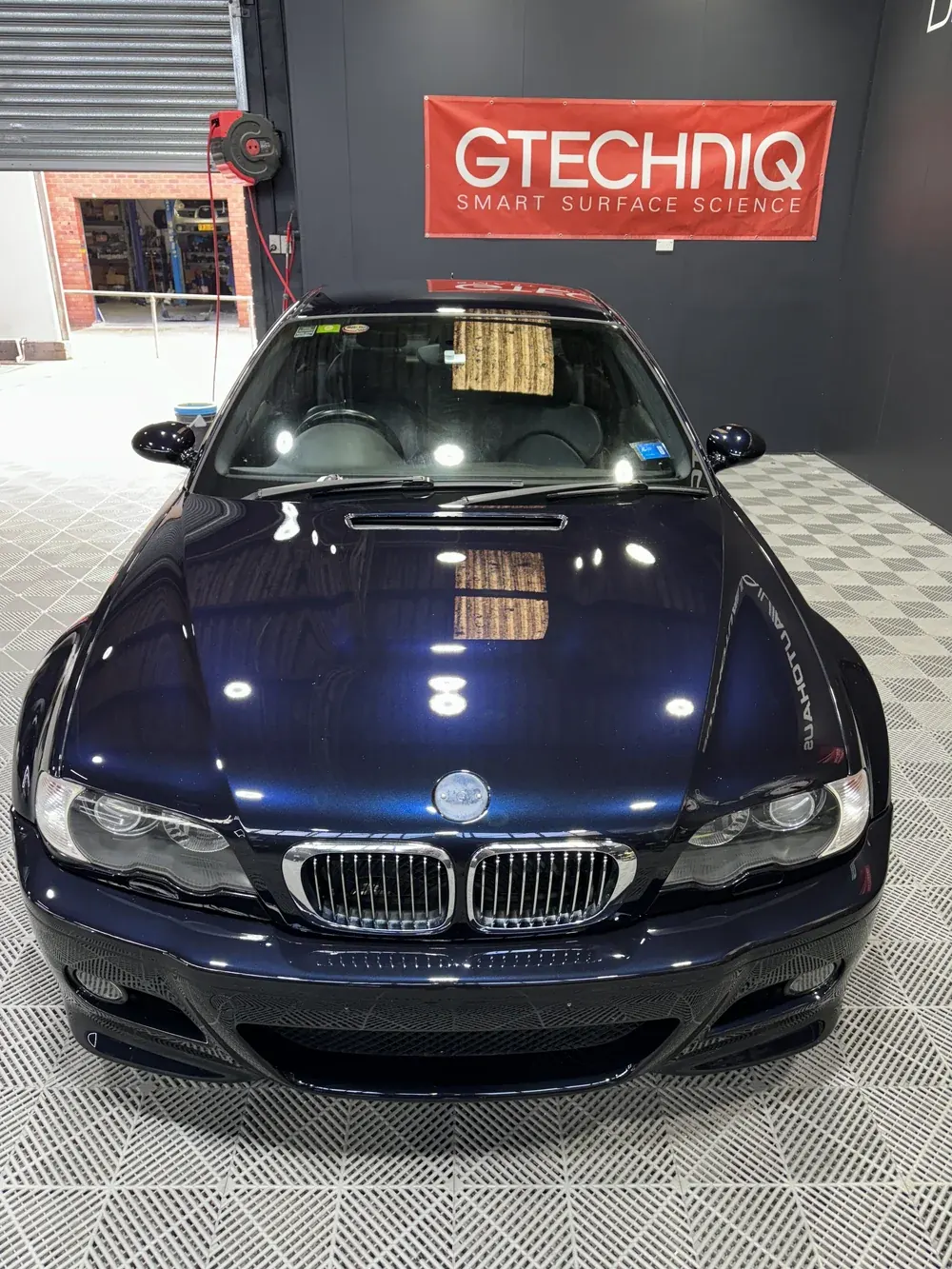 Dark blue BMW in the studio