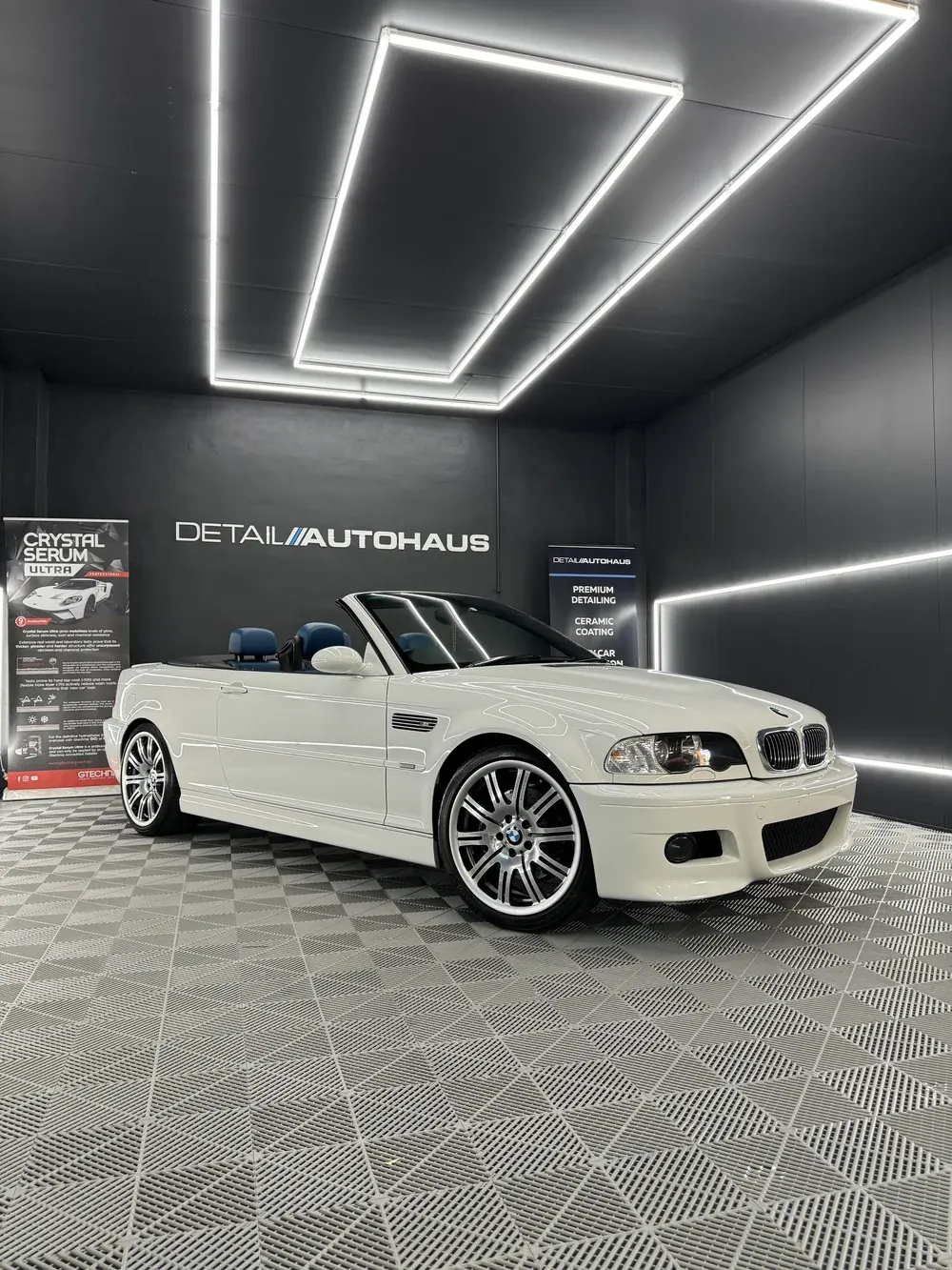 White BMW E46 M3 convertible under the studio light tunnel