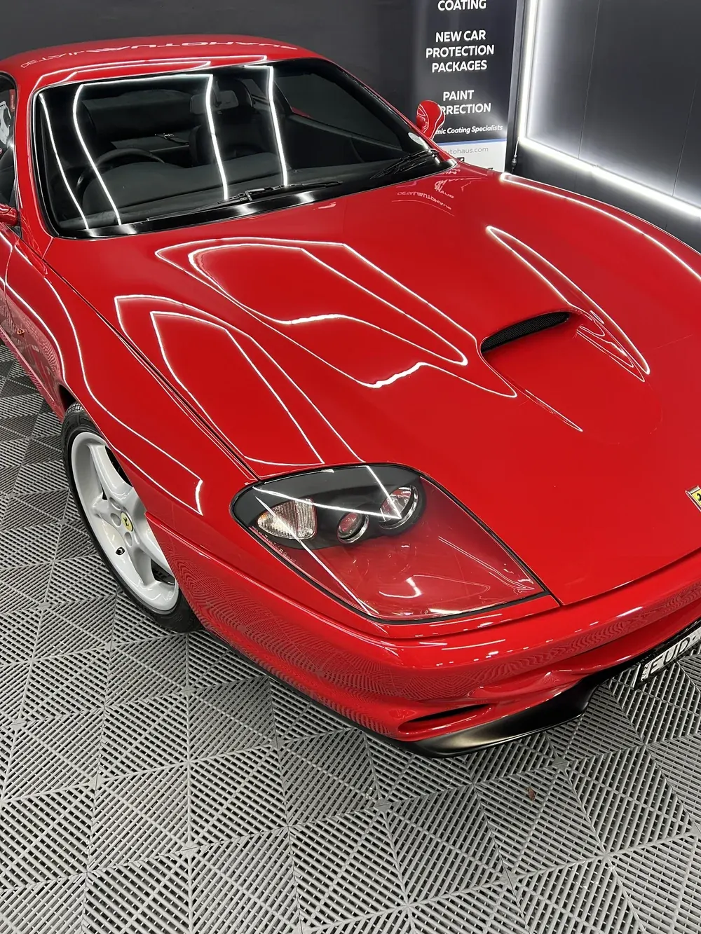 Red Ferrari bonnet and front end in the studio