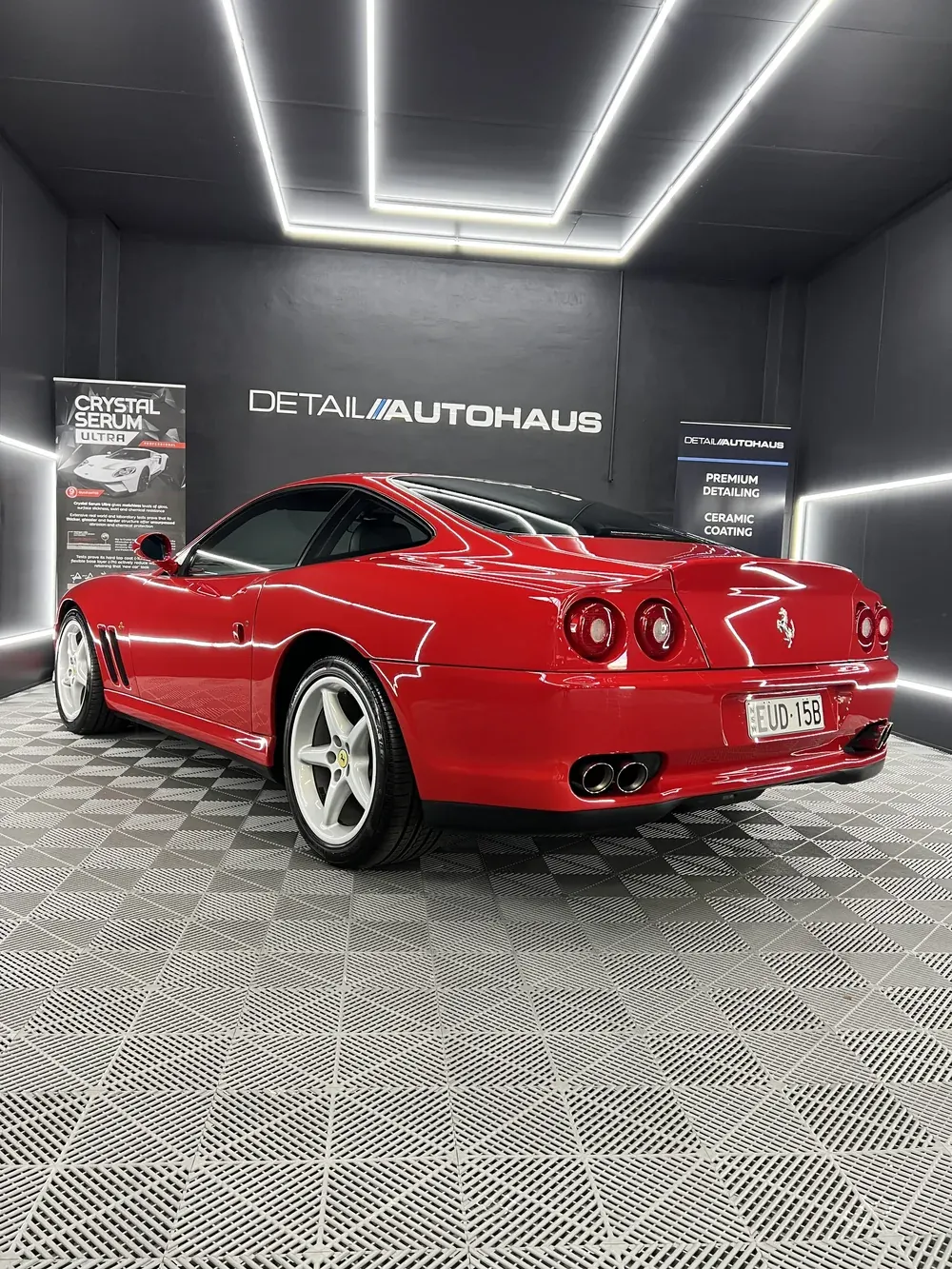 Red Ferrari under the light tunnel